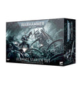 Damaged Warhammer 40,000 starter box with miniature sprues and rulebook visible, dinged corner on box
